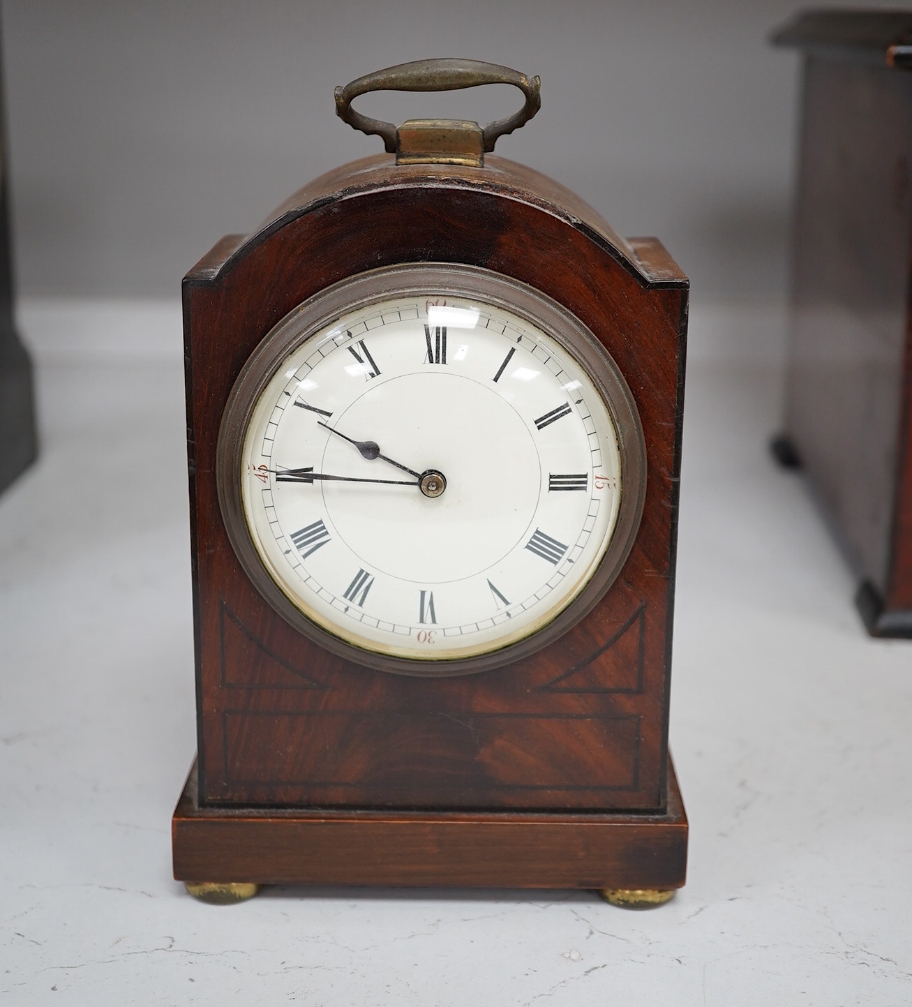 A slate mantel clock and a miniature bracket timepiece, slate clock 25cm high. Condition - miniature bracket time piece, polish on top worn,slate clock has fine scratch.